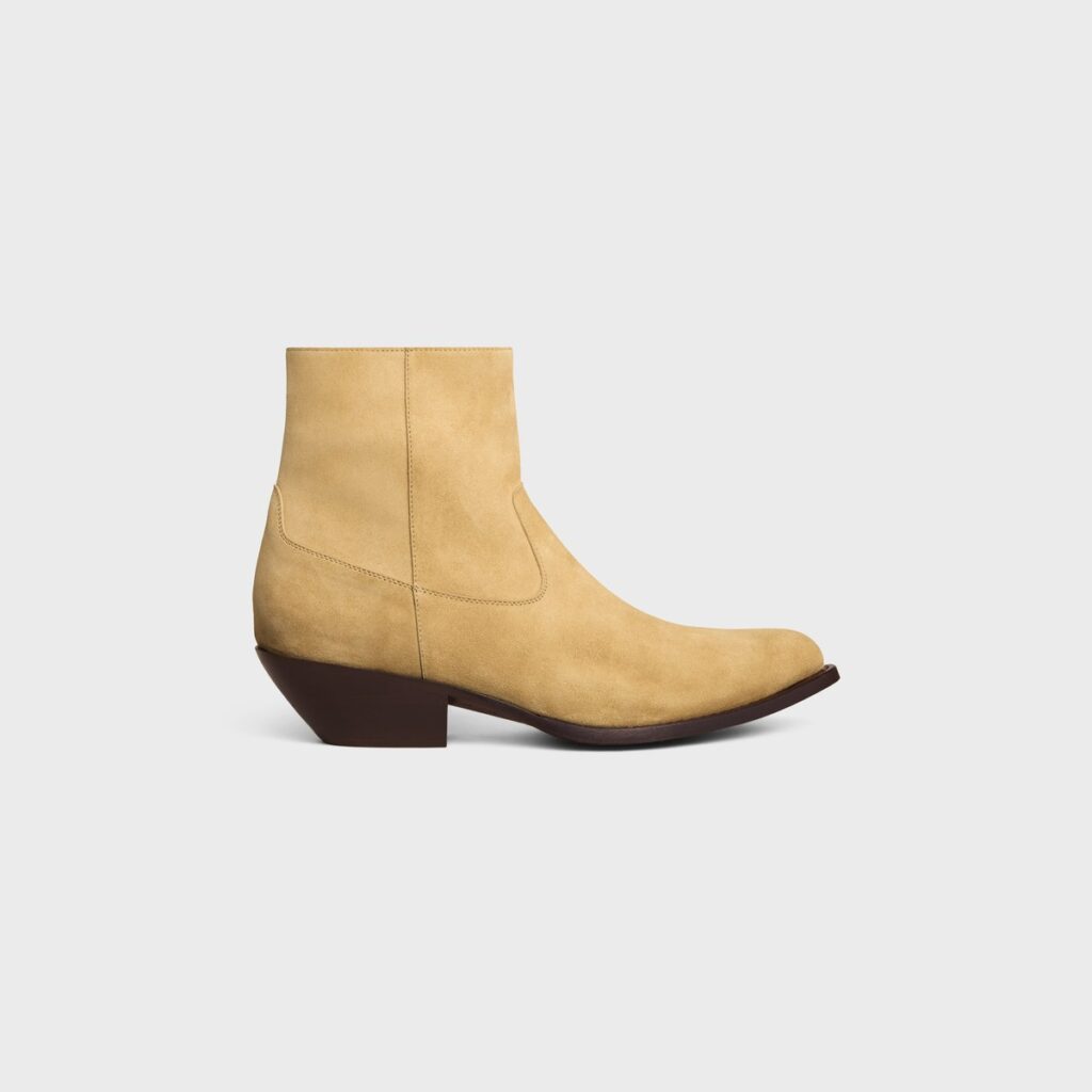Celine Western Boot in stone beige suede with a pointed toe and an angled dark stacked heel, side view