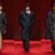 Leather trench coat outfit ideas from Bottega Veneta Fall 2026: a woven black leather coat over khaki trousers, a long black leather coat with a white shirt collar, and a padded black leather coat with a belt (looks 11, 56 and 61)