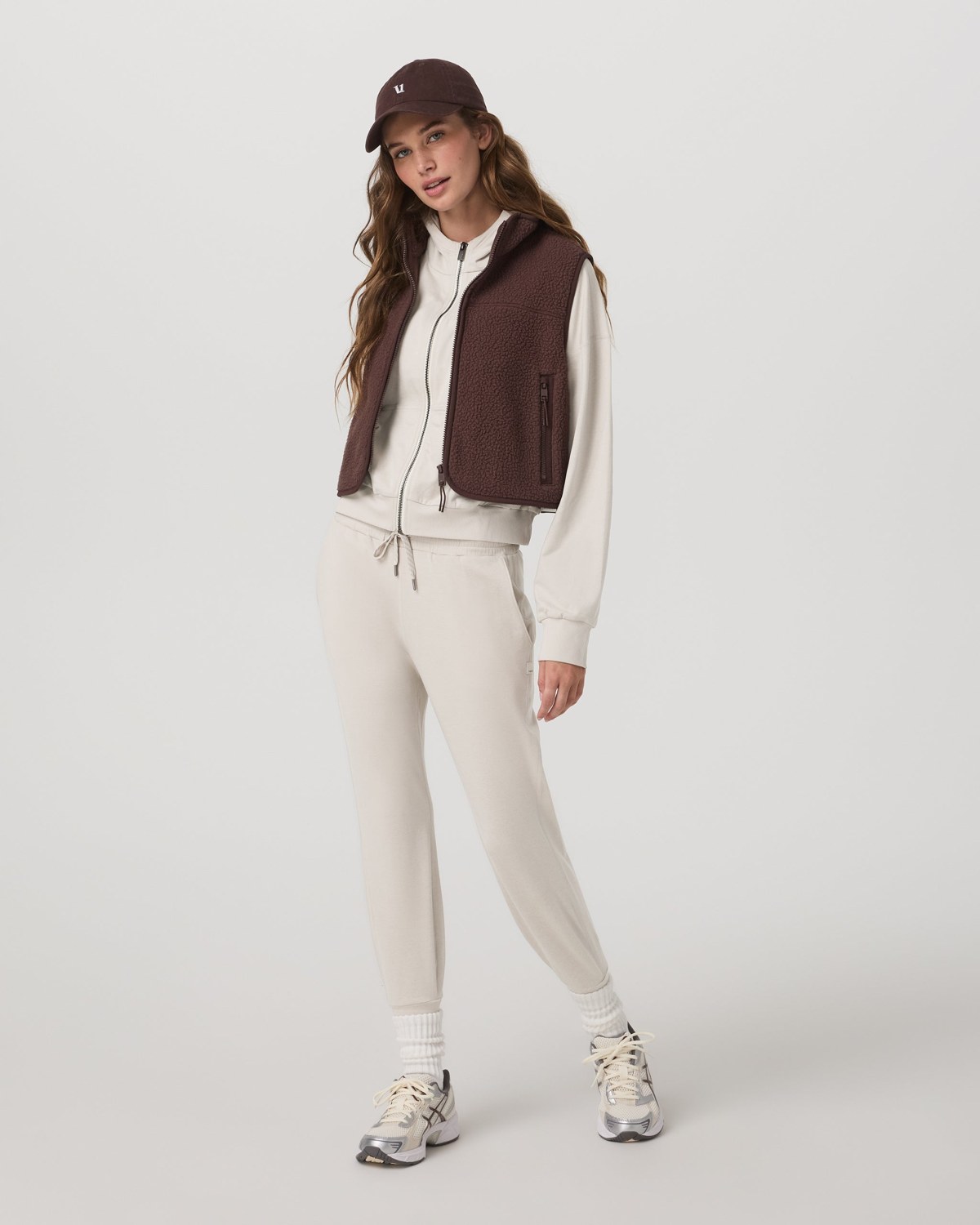 Vuori women's DreamKnit Performance Jogger styled with a zip hoodie and a sneaker